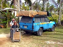 Tonga/Tongatapu: Liliana with crutches and the 'trolley' on the way to the doctor, while the LandCruiser is banned from driving